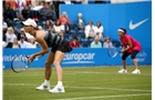 BIRMINGHAM, ENGLAND - JUNE 14:  Cara Black of Zimbabwe (front) and Sania Mirza of India (back) in action during their doubles semi-final match against Raquel Kops-Jones of the USA and Abigail Spears of the USA during day six of the Aegon Classic at Edgbaston Priory Club on June 14, 2014 in Birmingham, England.  (Photo by Jordan Mansfield/Getty Images for Aegon)